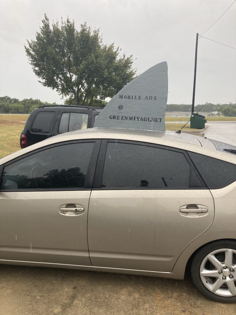 profile view prius with shark fin